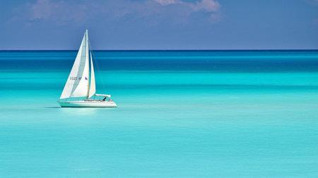 Sailboat on the turquoise water of the Caribbean Seaの素材