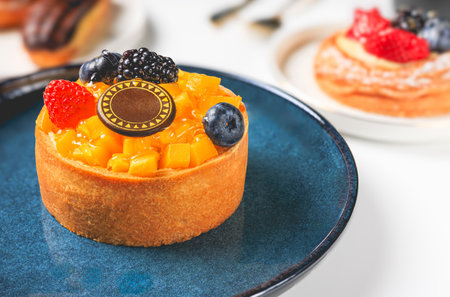 Piece of cake with fruits and berries on plate, closeupの写真素材