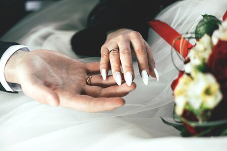Hands of man and woman with ringsの写真素材