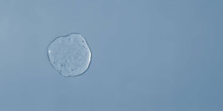 Sanitizer transparent gel on a blue backgroundの写真素材