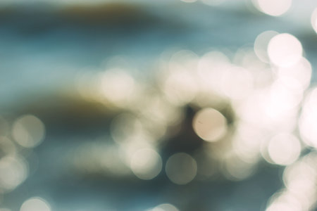 Blurry background with waves with blue, white and gold highlights