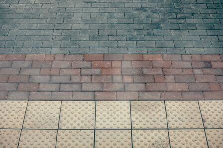 The texture of the paved tile. Cement brick squared stone floor background. Concrete paving slabs. Paving slabsの写真素材