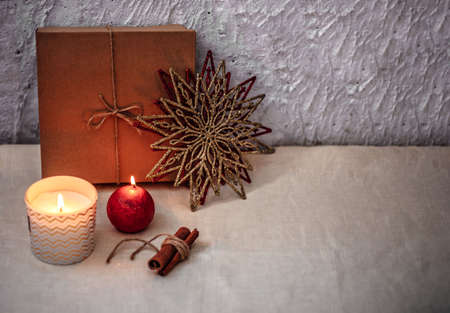Christmas or new year composition. Christmas decorations in gold and red colors with copy space for text. Holiday and celebration concept for postcard or invitation.の写真素材