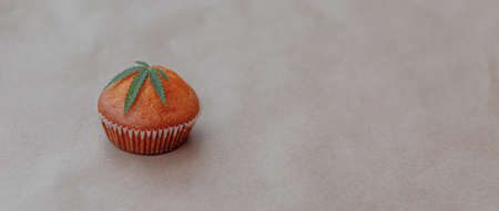 Cannabis leaf with cookies on kraft background.. Cannabis live resin extraction Medical marijuana conceptの写真素材