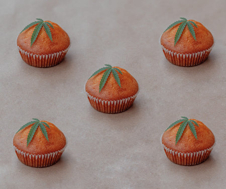 Pattern of cannabis leaf with cookies on kraft background.. Cannabis live resin extraction Medical...