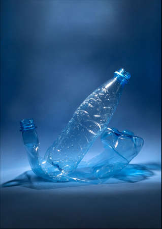 Blue plastic bottles on a blue background. Concept of waste disposal. Copy spaceの写真素材