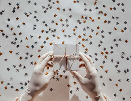 Gold frame. Golden and silver confetti stars glitter on a white isolated background. Festive holiday backdrop. Copy spaceの写真素材