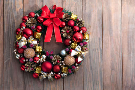 Christmas wreath on wooden background. Christmas decor handmade. Top viewの写真素材