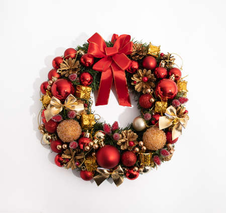 Decorative festive wreath with red and golden christmas toys isolated on white. Top viewの写真素材