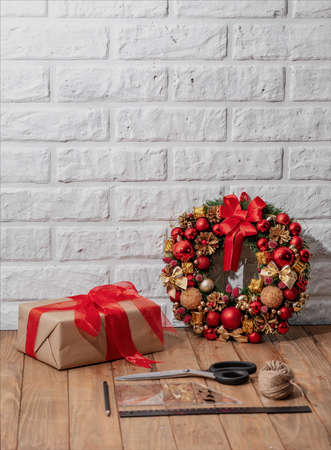 Christmas wreath on wooden table. Christmas decor handmade. Top viewの写真素材