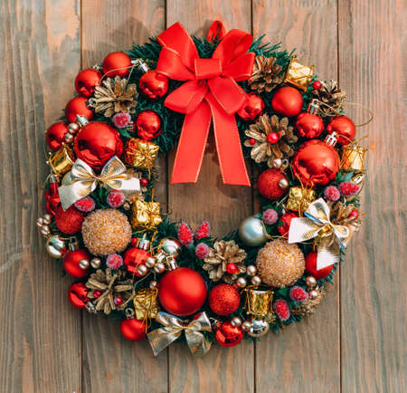Christmas wreath on wooden background. Christmas decor handmade. Top viewの写真素材