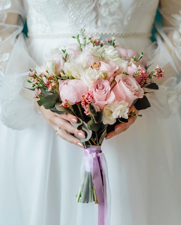 woman with bridal bouquet. eremony wedding day. hands with wedding rings.の写真素材