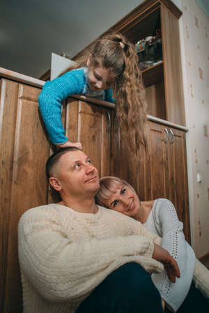 Happy family having fun. mother and father smilingの写真素材