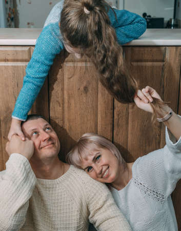 Happy family having fun. mother and father smilingの写真素材