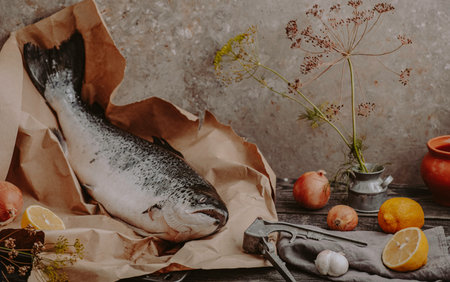 Still life with fish and vegetables on a kitchen table