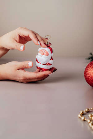 Preparing for the New Year holidays. Santa claus figurine in handsの写真素材