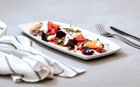 fillet and fresh vegetable salad of lettuce, arugula, spinach, cucumber and tomato. Healthy lunch...