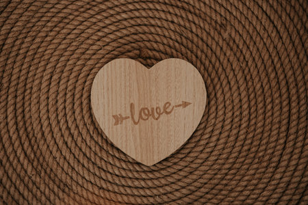 Heart shape made of wood with the inscription love. Valentines Day.の写真素材