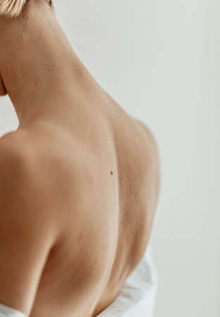 Woman Body Care. Close Up Of back. Spa, skin care and wellness. Light backgroundの写真素材