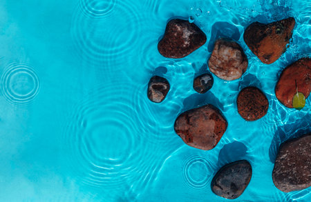 Sea stones in the sea water. Pebbles under water. Stones In Blue Water - Zen Concept