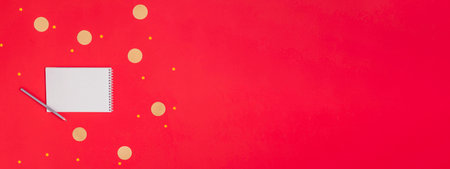 Notebook with text GOALS 2023 on red background. Motivation, inspiration. Planning, plans and tasks. New business ideas. Setting goal, target.の写真素材