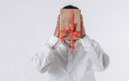 gift box instead of a head. Futuristic Christmas concept. Sustainable Christmas, zero waste, plastic free, eco friendly.の写真素材