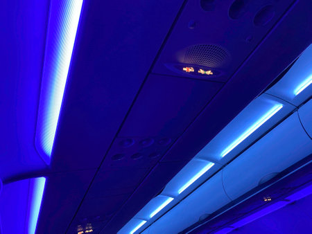 Airplane ceiling at night. No Smoking and Fasten Seat belt Sign Inside an Airplaneの写真素材