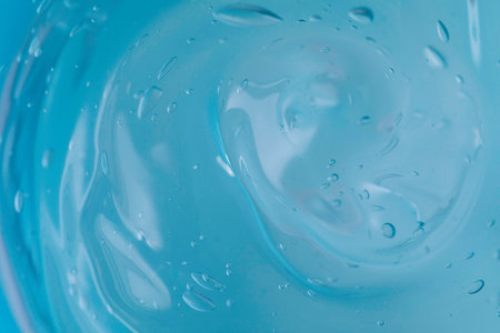 Transparent blue Gel background. Virus protection or facial moisturizing cosmetics concept.