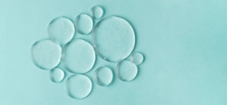 Cosmetic lotion transparent gel drops texture background, blue