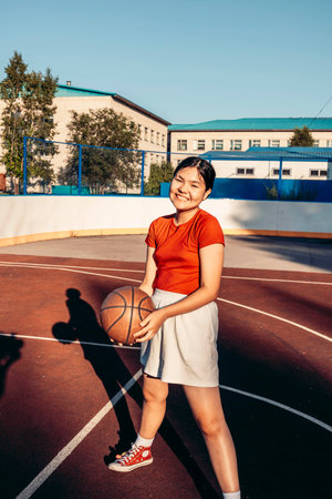 female youth smiling before basketball match, team spirit, friendship and fitness