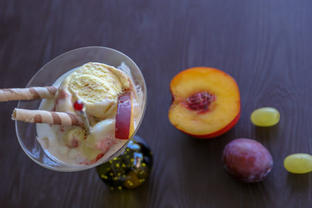 the most beautiful fresh ice-cream of hot summer days and besides the fruits