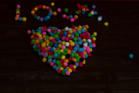 background made of colorful pom-poms for loveの写真素材