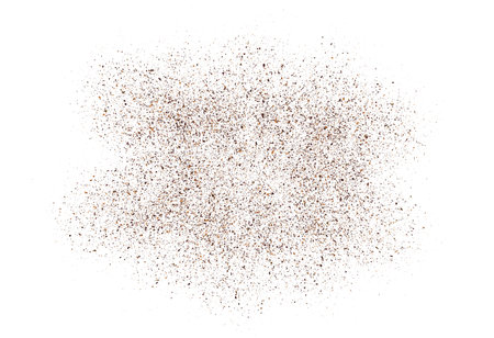 Coffee or chocolate powder, flying dust particles. Coffee colored dust grain texture isolated on white background. Crushed granules of sand or brown cane sugar. Vector illustration of spilled powder.のイラスト素材