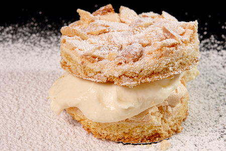Cream bun with almonds, meringue and lemon curd