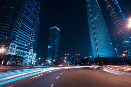 Shanghai Lujiazui Finance and Trade Zone of the modern city night backgroundの写真素材