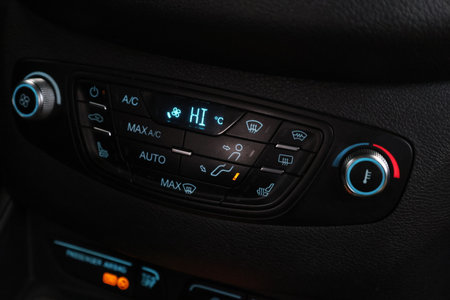 car black interior: dashboard with temperature, adjustment of the blower, air conditioner and other buttons.の写真素材