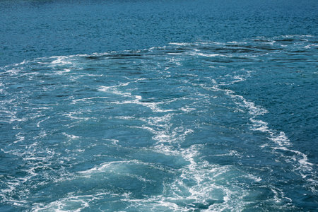 Ocean Water Surface with Waves and Foamの写真素材