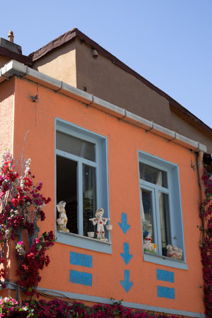 Colorful Building with Bougainvillea and Ceramic Dollsの写真素材