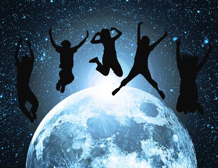 abstract moon in space with silhouette of jumping peopleの写真素材