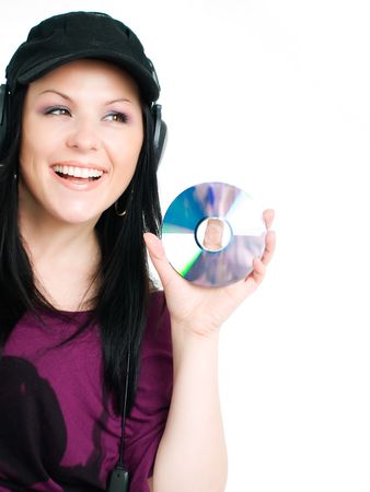 smiling woman with headphones holding cdの写真素材
