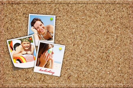 cork board with holiday photos of happy joying peopleの写真素材