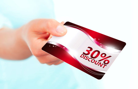 hand holding red discount card isolated over white background