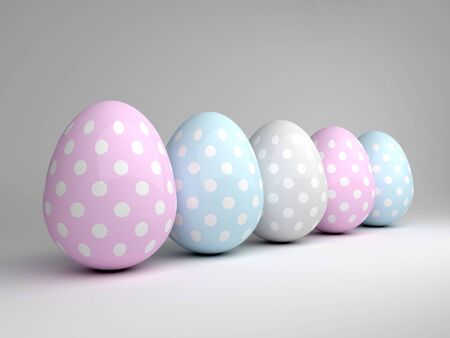 3d elegant pastel Easter eggs lying on grey backgroundの写真素材