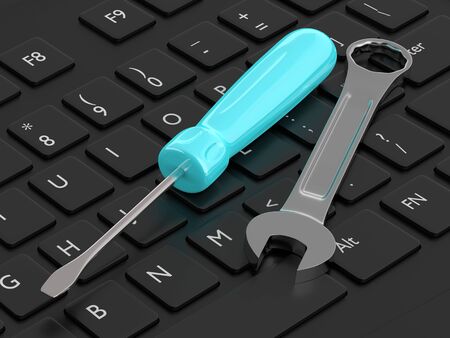3d render of screwdriver with wrench lying on computer keyboard. Computer service conceptの写真素材