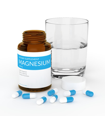 3d render of magnesium pills in bottle with glass of water isolated over white backgroundの写真素材