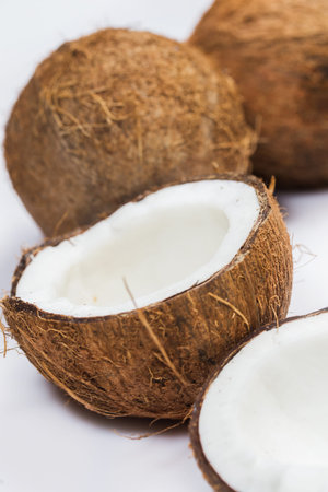 Fresh coconuts on white background