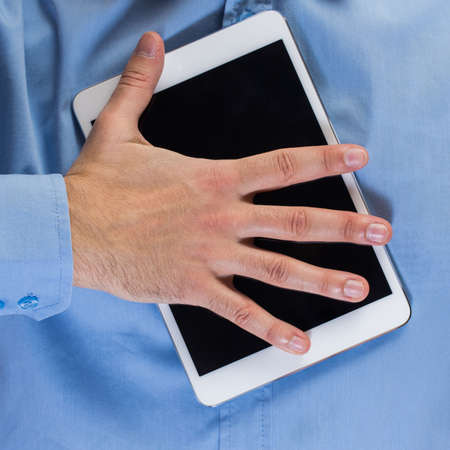 Close up of man hands holding white tablet pcの写真素材