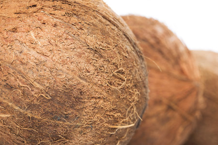 Fresh coconuts on white background
