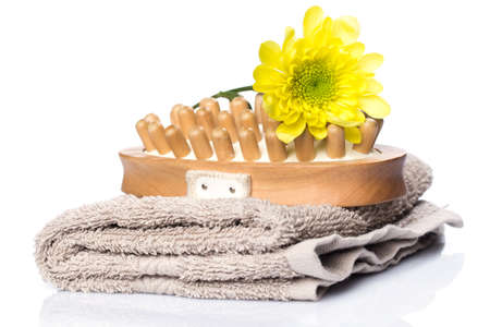 Towel and brush for massage over white backgroundの写真素材