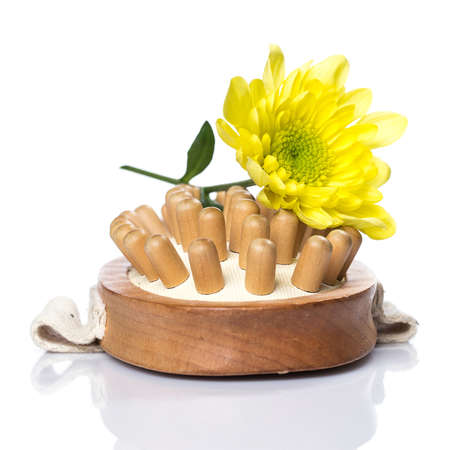 Towel and brush for massage over white backgroundの写真素材